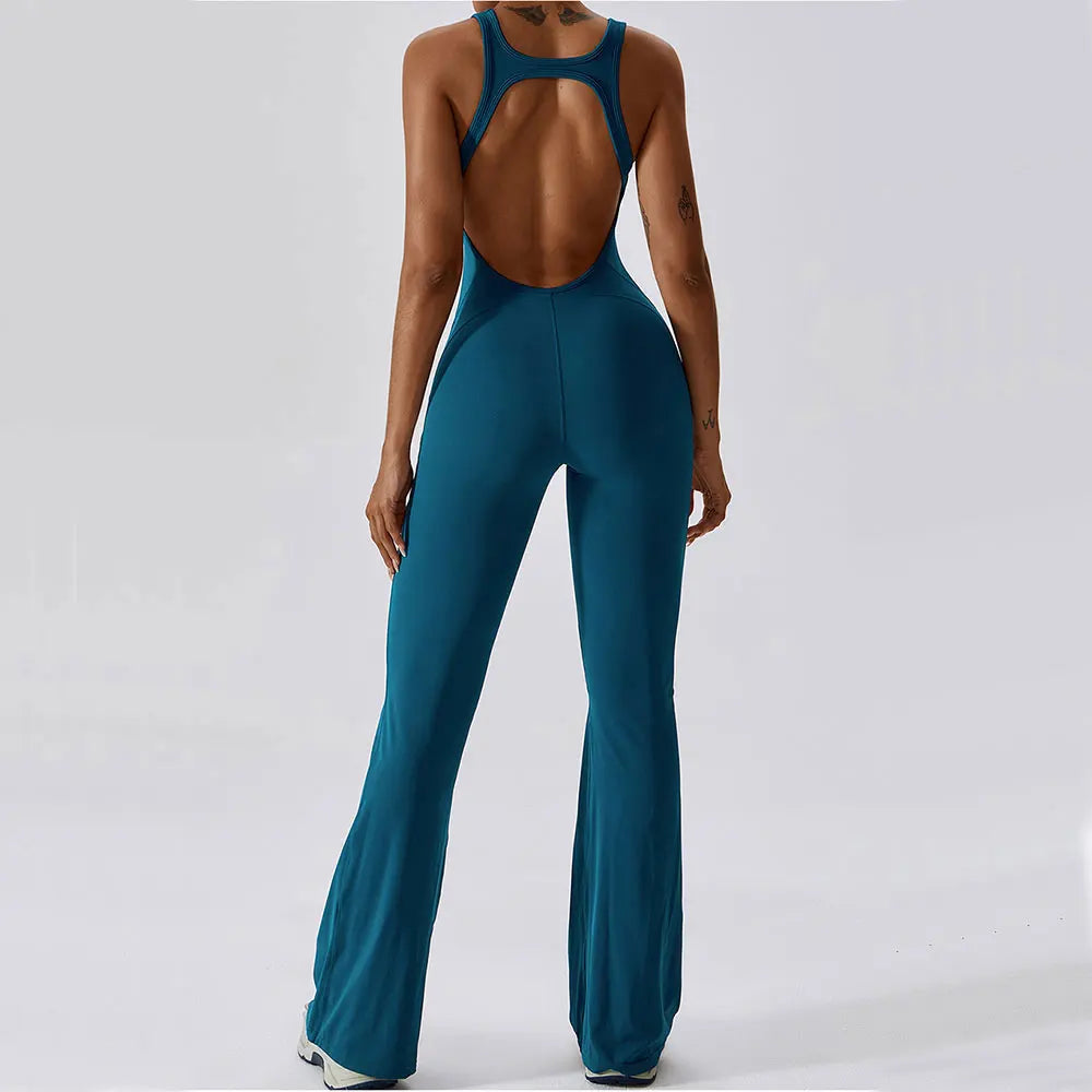 Teal jumpsuit with open back on a white background